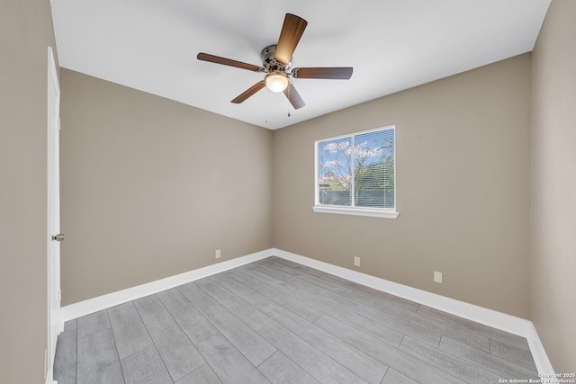 unfurnished room with ceiling fan and light hardwood / wood-style flooring