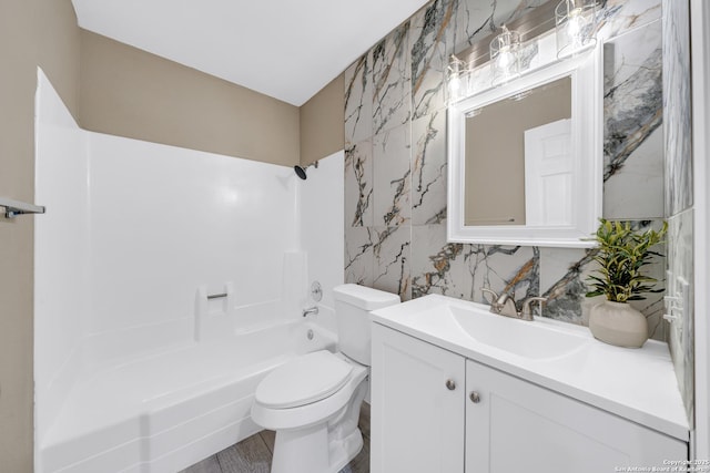 full bathroom with tasteful backsplash, shower / tub combination, vanity, and toilet