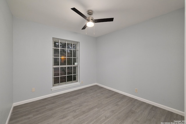 empty room featuring wood-type flooring and ceiling fan