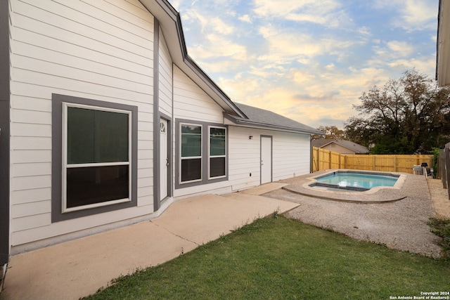 view of pool featuring a patio area and a yard