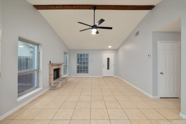 unfurnished living room with beamed ceiling, light tile patterned floors, ceiling fan, a brick fireplace, and high vaulted ceiling