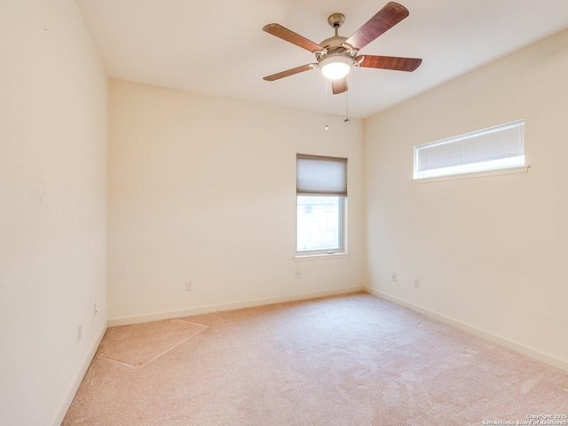 carpeted empty room with ceiling fan