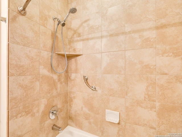 details with tiled shower / bath combo