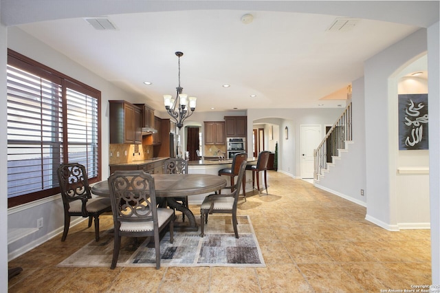 dining room with a chandelier