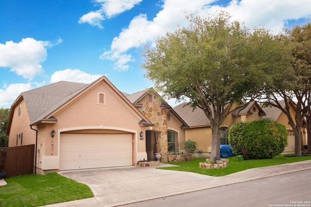 view of front of house with a garage and a front lawn