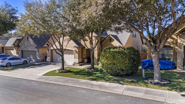 view of front of home featuring a garage and a front lawn