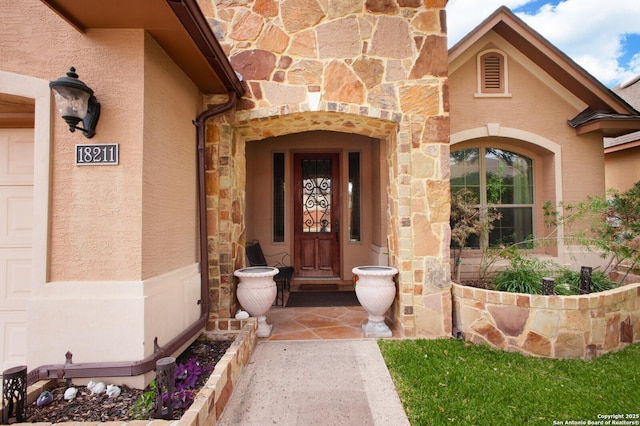 view of exterior entry featuring a garage