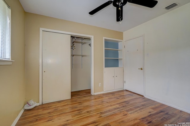 unfurnished bedroom with ceiling fan and light hardwood / wood-style floors