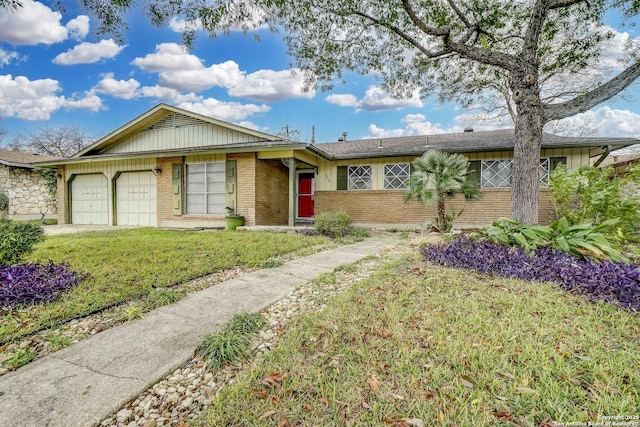 ranch-style home with a garage and a front lawn