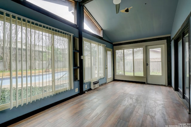 unfurnished sunroom featuring lofted ceiling