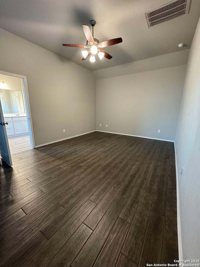 spare room with ceiling fan, dark hardwood / wood-style flooring, and lofted ceiling