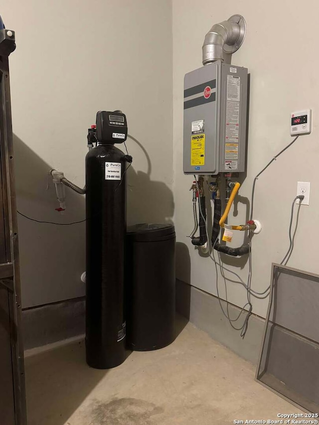 utility room featuring water heater