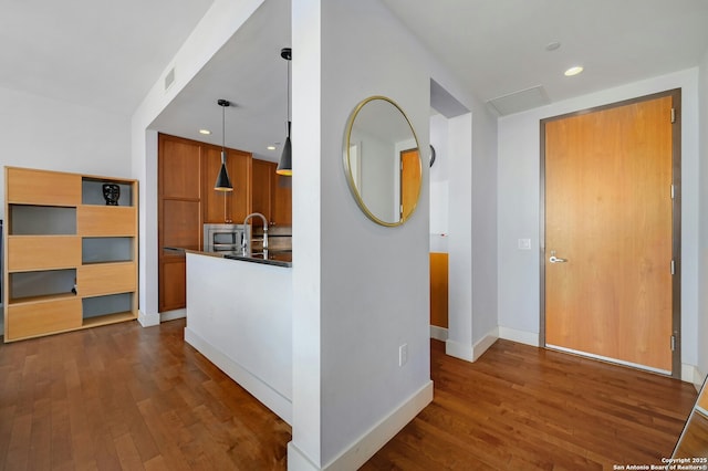 hallway featuring dark hardwood / wood-style floors