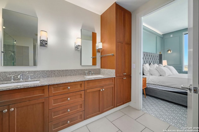 bathroom featuring tile patterned flooring and vanity