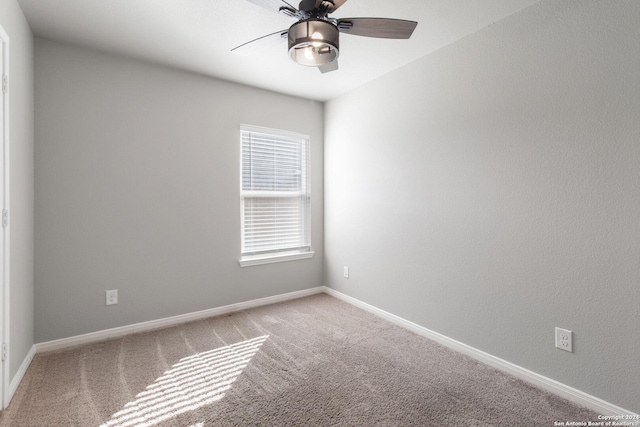 carpeted empty room with ceiling fan