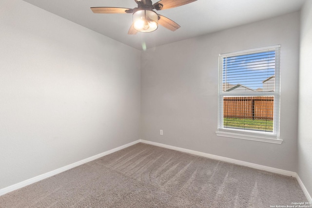 carpeted empty room with ceiling fan