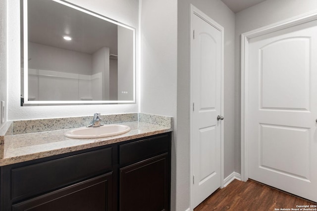 bathroom with wood-type flooring and vanity