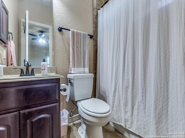 bathroom featuring tile patterned floors, vanity, a shower with curtain, toilet, and ceiling fan