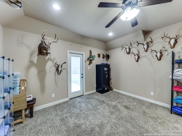 miscellaneous room featuring ceiling fan and light carpet