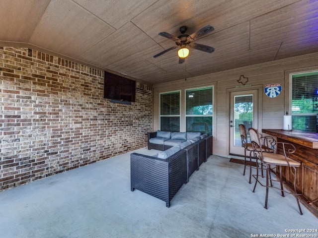 view of patio featuring an outdoor hangout area, ceiling fan, and an outdoor bar