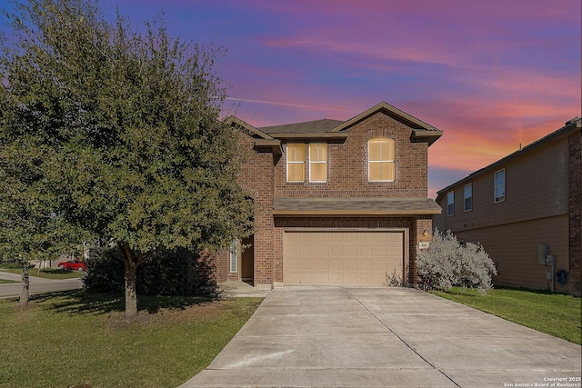 view of property with a garage and a yard