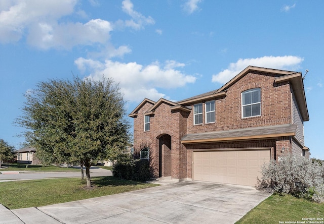 view of front of home with a front lawn and a garage