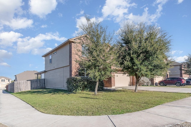 view of front facade with a garage and a front lawn