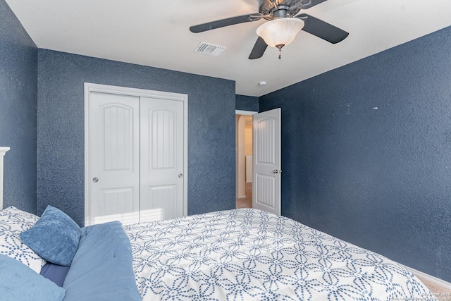 bedroom with a closet and ceiling fan