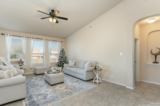 living room featuring ceiling fan and lofted ceiling