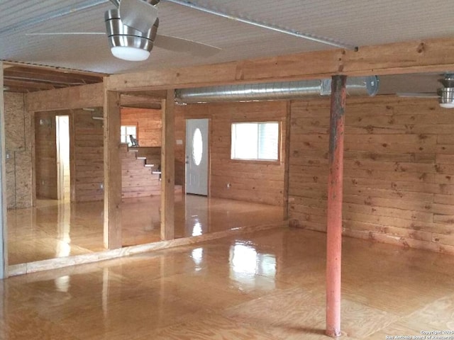 interior space with wooden walls and stairs