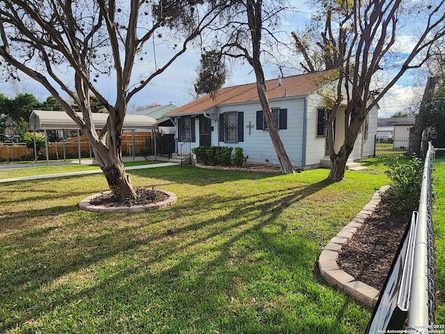 ranch-style home with a front lawn and a carport