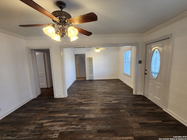 foyer entrance featuring ceiling fan, dark hardwood / wood-style flooring, and crown molding