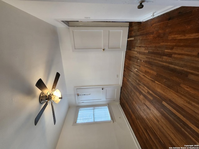 interior space featuring wood walls