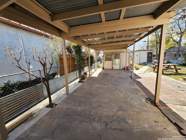 view of patio with a storage shed