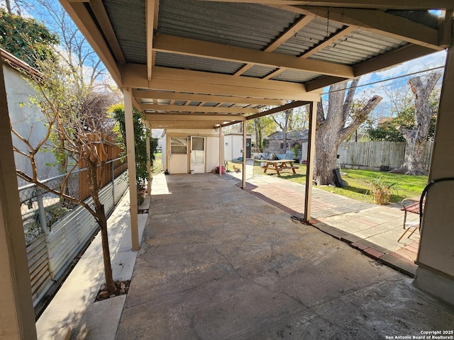 view of patio / terrace featuring a storage shed