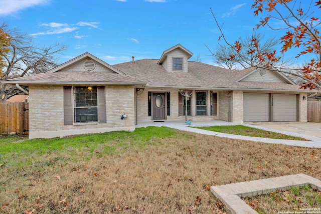 ranch-style home with a garage and a front yard