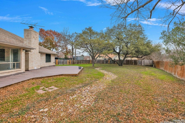 view of yard with a wooden deck