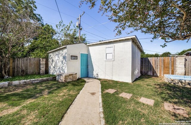 view of outdoor structure featuring a yard