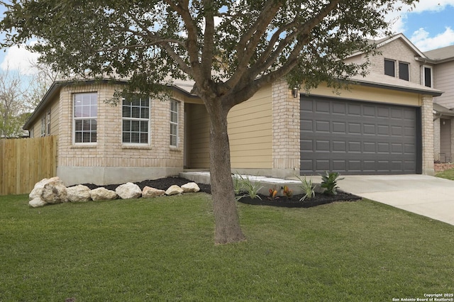 view of front of property with a garage and a front yard