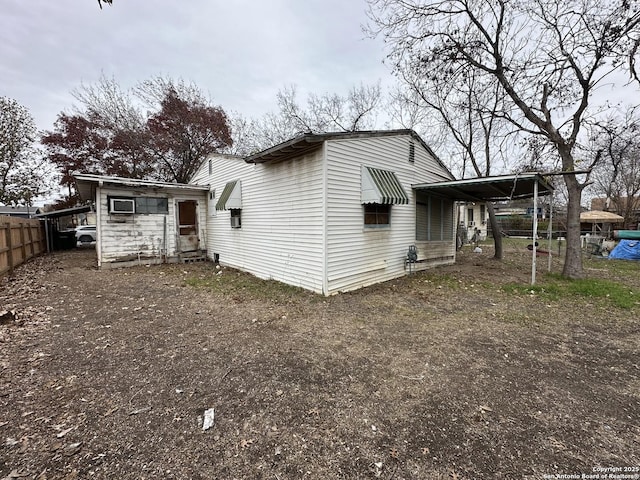 rear view of house with a carport