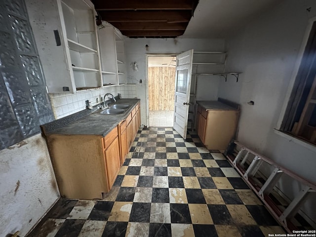 kitchen featuring sink and tasteful backsplash