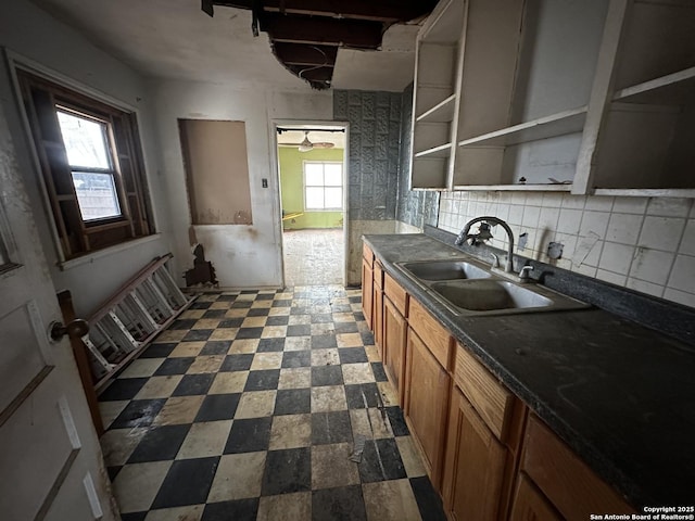 kitchen featuring decorative backsplash and sink