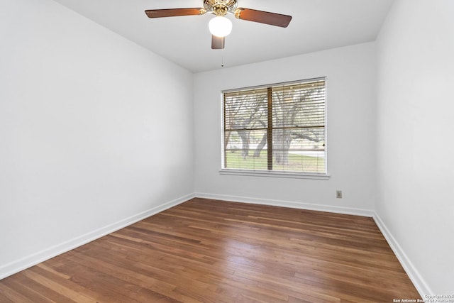 unfurnished room with ceiling fan and dark hardwood / wood-style floors