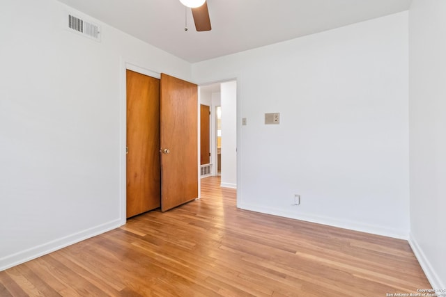 spare room featuring ceiling fan and light wood-type flooring