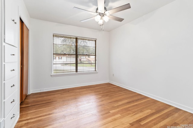 unfurnished bedroom featuring ceiling fan and light hardwood / wood-style floors