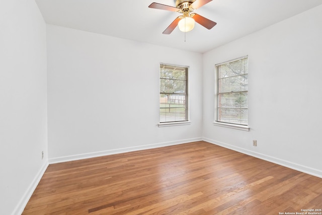 spare room with ceiling fan and wood-type flooring