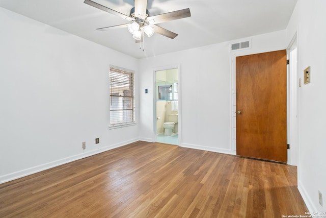 spare room featuring ceiling fan and hardwood / wood-style floors