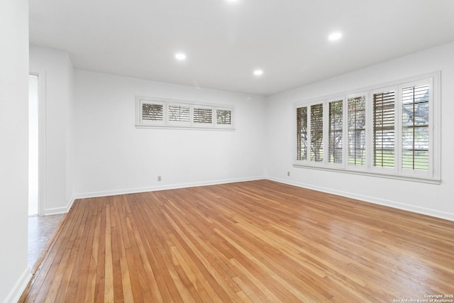 spare room featuring light hardwood / wood-style floors