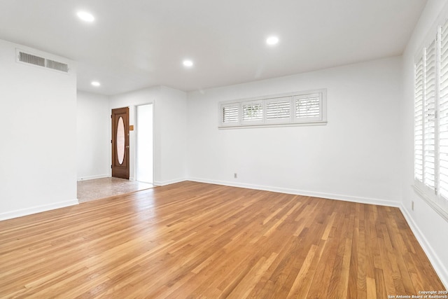 spare room featuring light hardwood / wood-style flooring