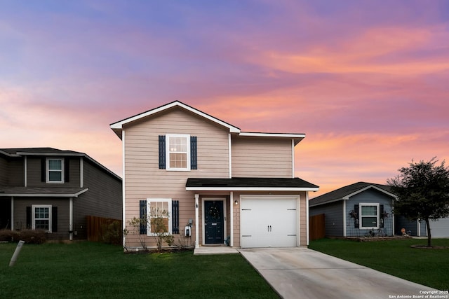 front facade with a yard and a garage